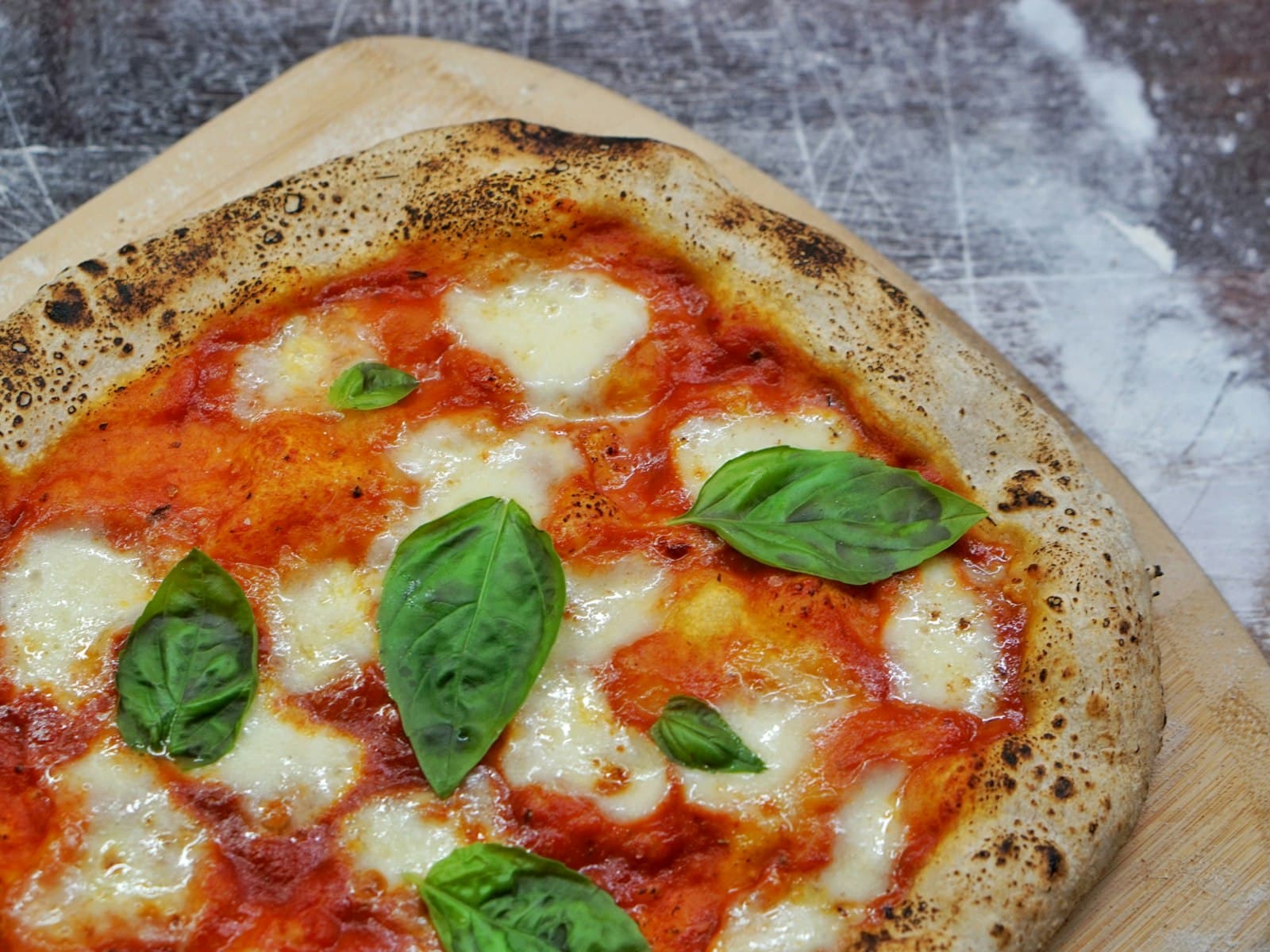 A freshly baked pizza with a golden, blistered crust